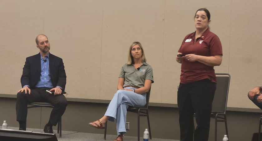 Bettlyn Krafft (R) discusses workforce strategies with Steve Davis and Carrie Aaron.